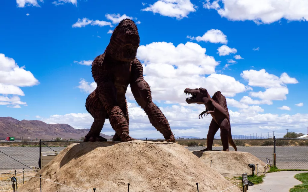 A dinosaur and King Kong guard the grounds of the Peggy Sue 50's Diner.