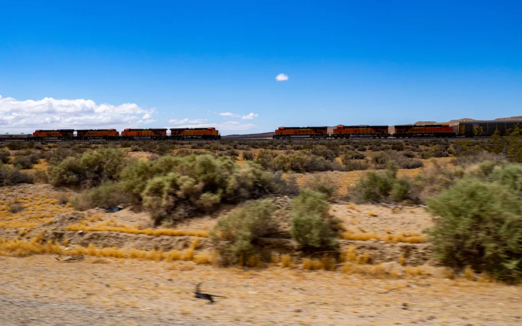 Two trains are about to pass each other along Route 66.